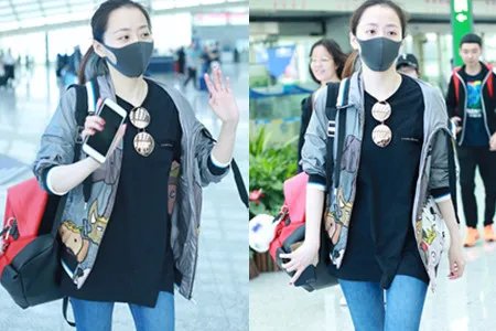 张靓颖被曝获接机 绯闻男友打扮低调现身与其一同离开