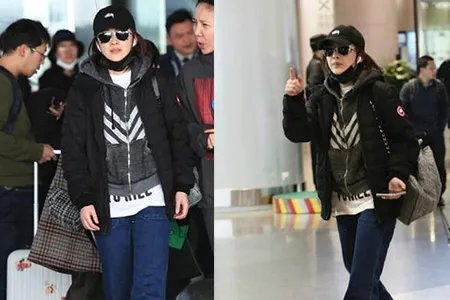 梅婷黑酷装现身风格独特 机场露面与老公相视而笑很开心